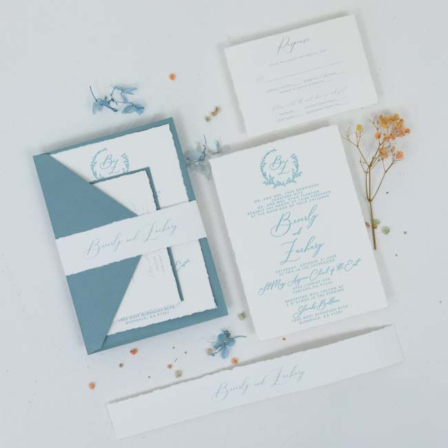 Thumbnail: Top view deckle edge wedding invitation