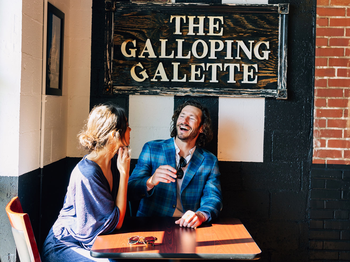 Picture of a waffle covered in strawberries, blueberries and whipped cream