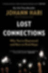 Black book cover for Lost Connections by Johann Hari, with sparklers held below and gold-and-white title text.