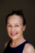Panoramic view of a desert with sand dunes and clear sky.