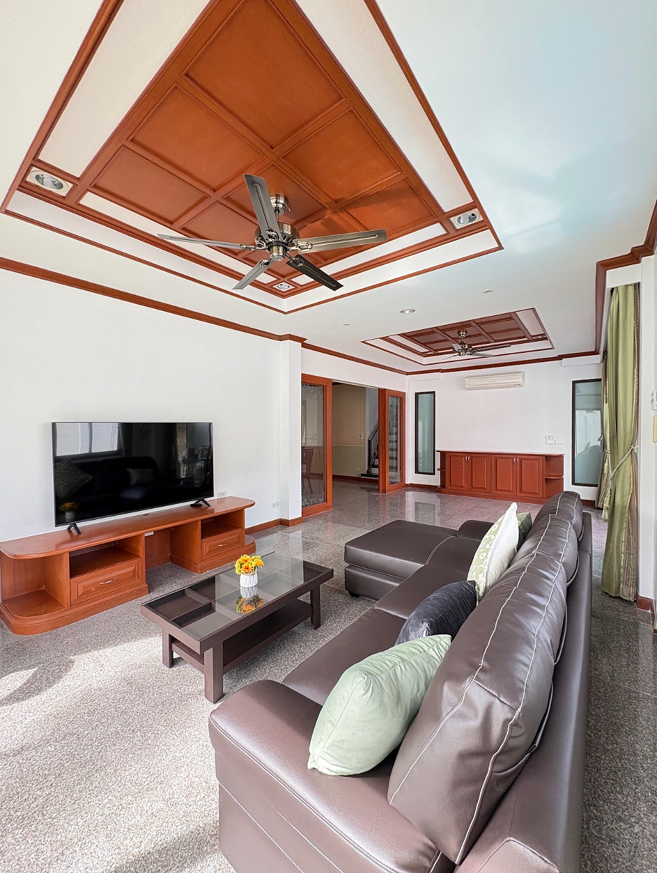 Bright and spacious living room with cozy seating.