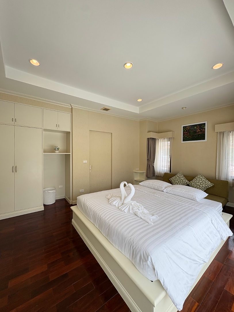 Spacious master bedroom with extra comfort for a relaxing stay.