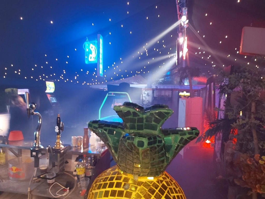 Mirror ball pineapple on a bar top