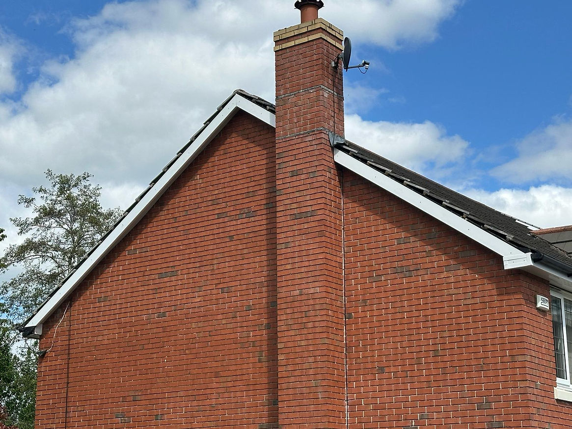 End of a detached home, white roofline