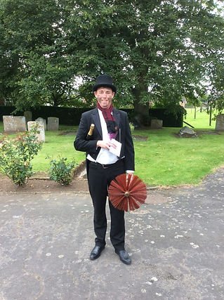 Chimney sweep in a church yard