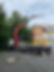 Large lorry lifting equipment into an office building