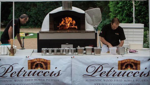 Outdoor pizza oven at a food stall