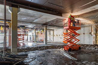 Manual Workers welding at Construction site while standing on scissor lift_edited.jpg