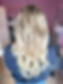 woman with curly hair, back of their head