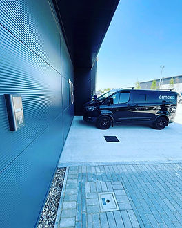 Company van parked outside industrial units
