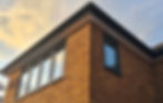New roofline installation, cloudy sunset