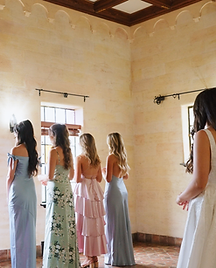 Emotional bridesmaids' first look at the bride, a heartwarming moment often captured by Tampa wedding videographers.