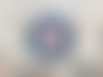 Students and staff gathered inside St. Victor Church during a school prayer service.  A student hold a large wooden cross while others participate in the liturgy, honoring Mary during the Month of the Holy Rosary. 