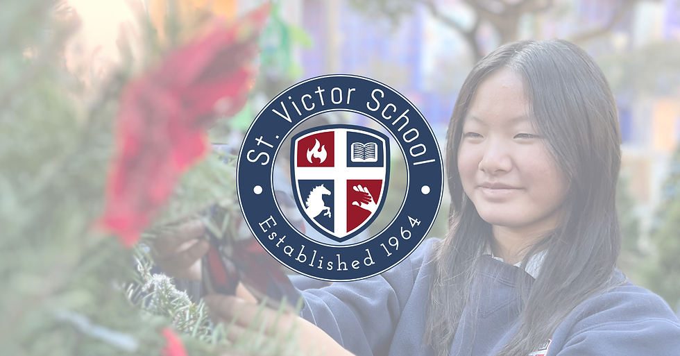 Student decorates a Christmas tree with red poinsettias as part of St. Victor School’s participation in Christmas in the Park, celebrating the Season of Joy, creativity, and gratitude during Advent.