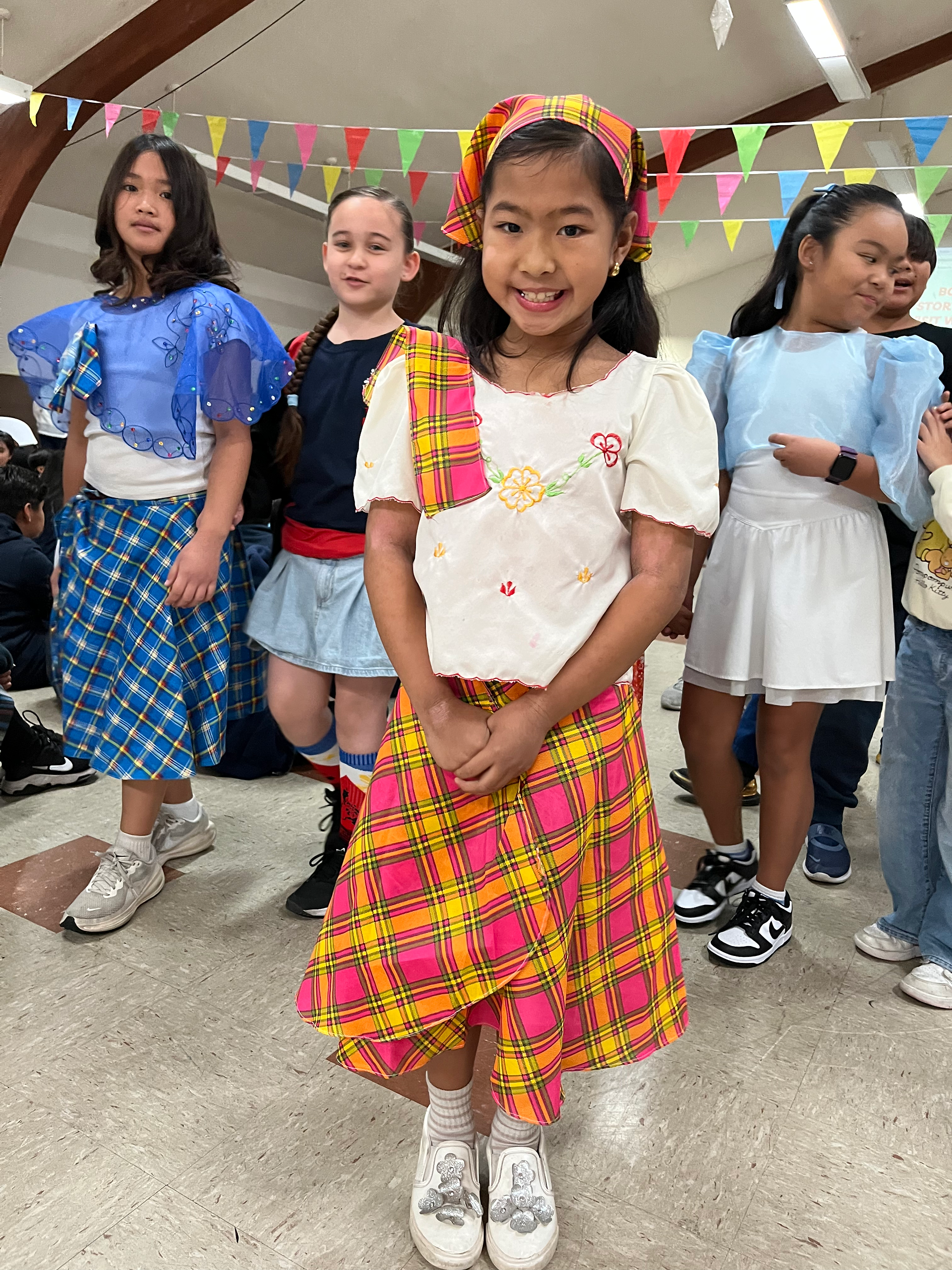 Students proudly wear traditional Filipino attire during St. Victor School’s Filipino American Histo