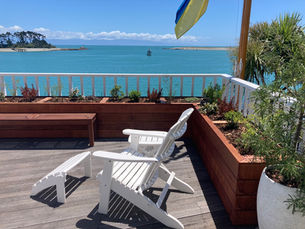 Hard wood raised beds framing a deck