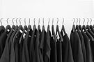 Black t-shirts on hangers