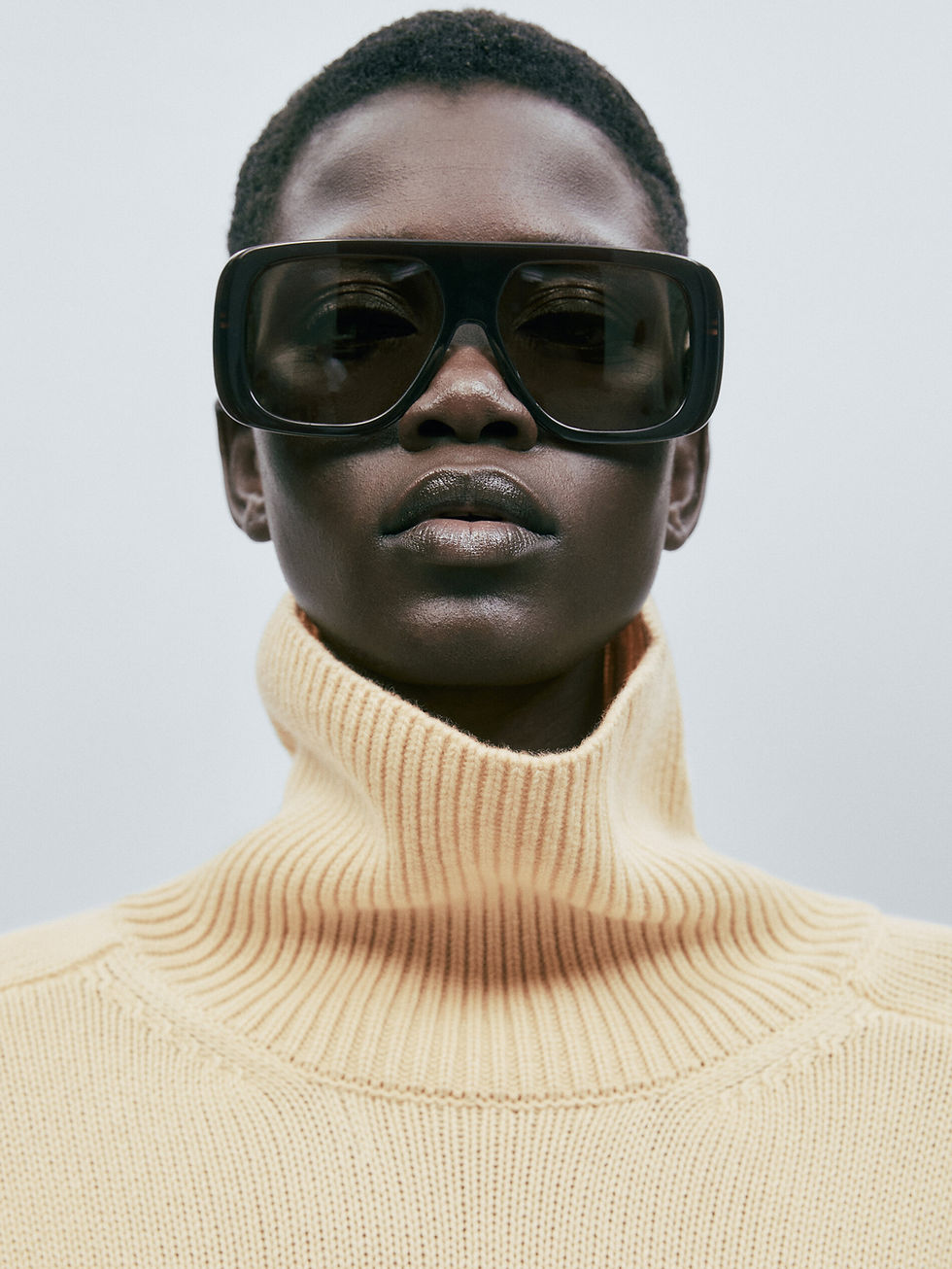 Woman in oversized black sunglasses