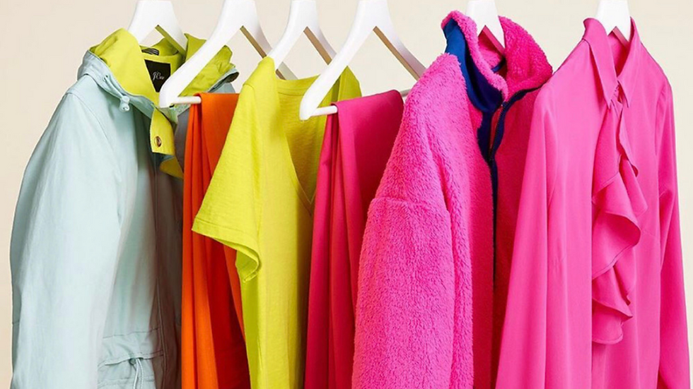 Colorful women's clothing on hangers