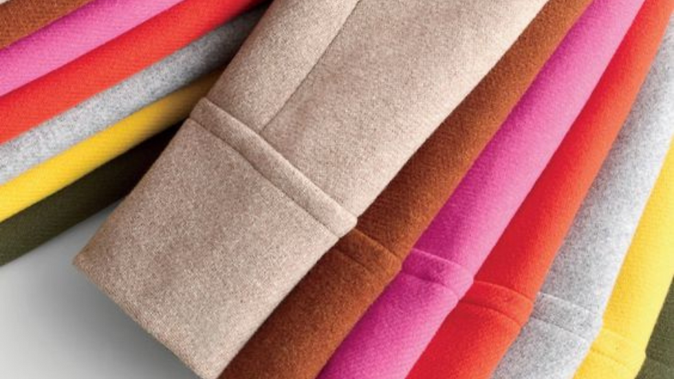 Stack of colorful wool coats