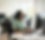 Female worker at desk, serious face.png