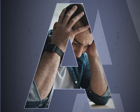 Man with head in hands feeling anxious