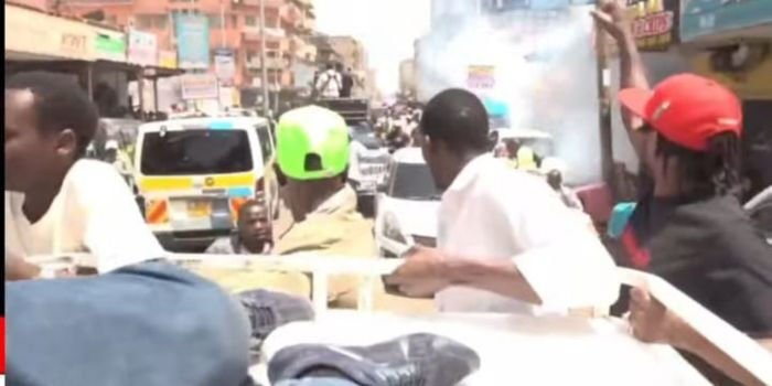 Youth watching as Kenyans scramble after police fire teargas at a United Opposition rally in Nairobi CBD, February 16, 2026 Photo YouTube