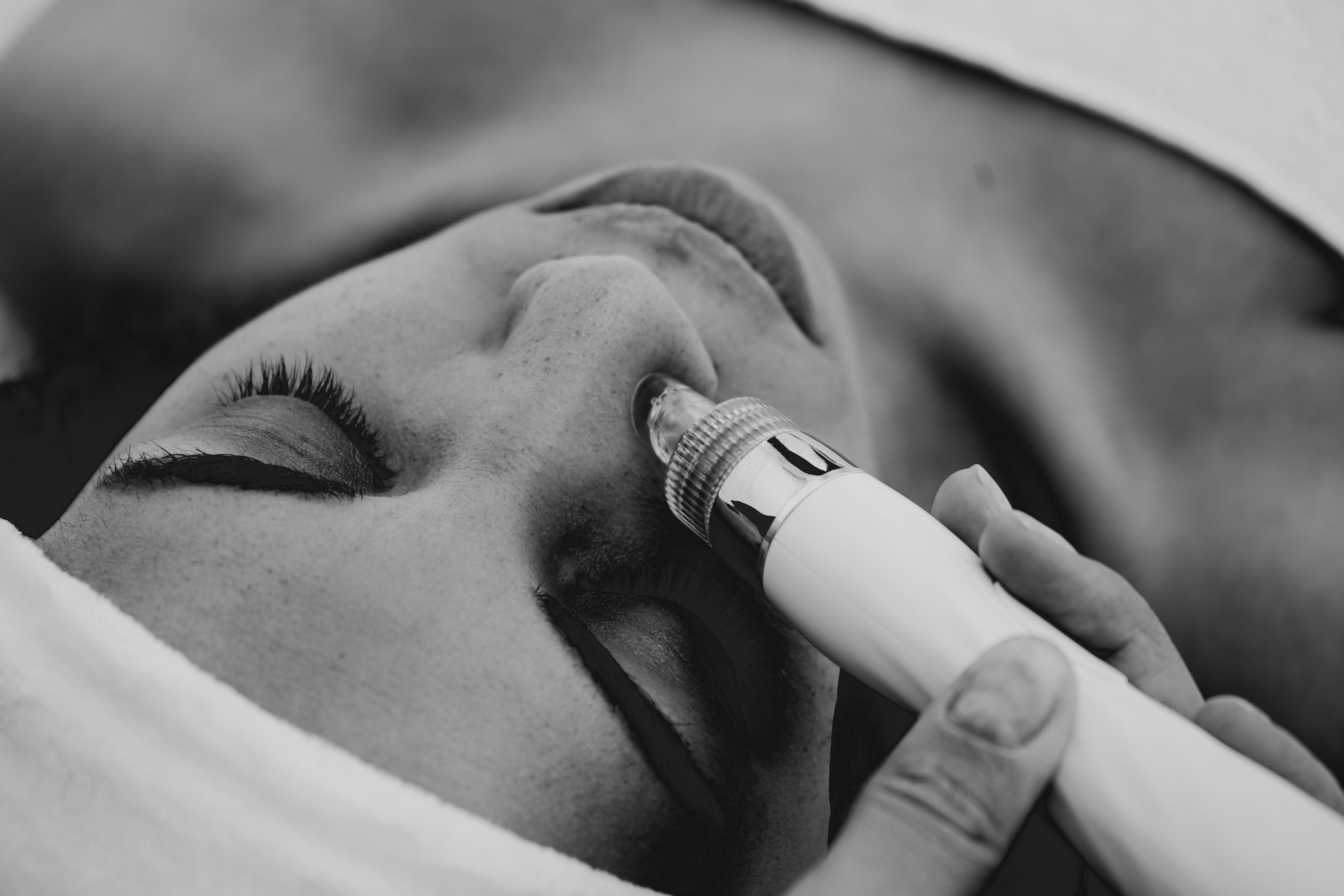 woman receiving hydra facial treatment
