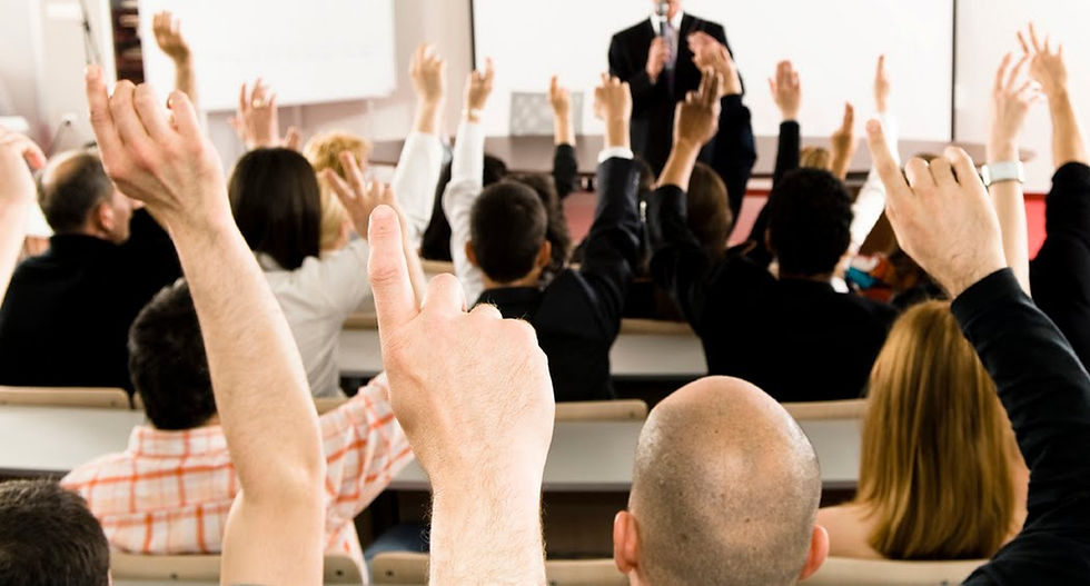 Members eagerly raise their hands to ask questions and seek advice from leadership,