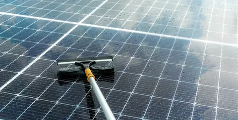 Orlando solar panel cleaning with soft bristle brush on extension pole for improved energy efficiency