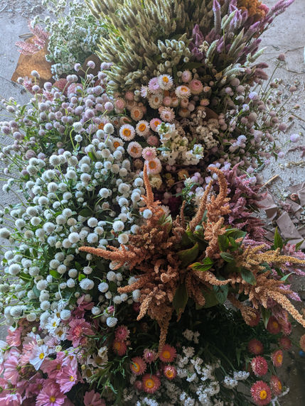 DIY bulk flowers with white gomphrena, tan amaranth, white strawflower, and white celosia.