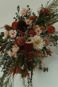 september wedding flowers burgundy terracotta cream blush arch