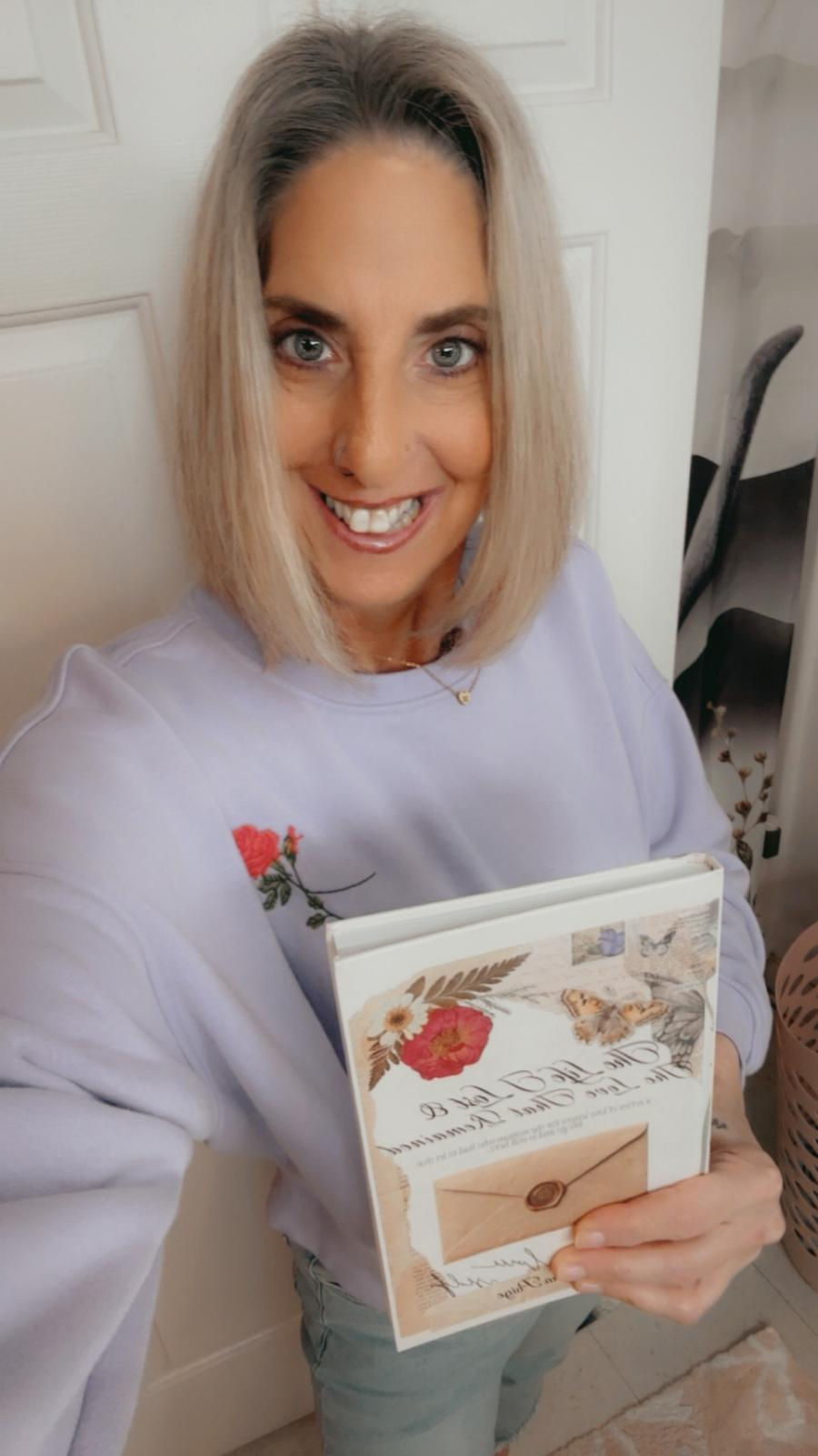 allison with book 1.jpeg