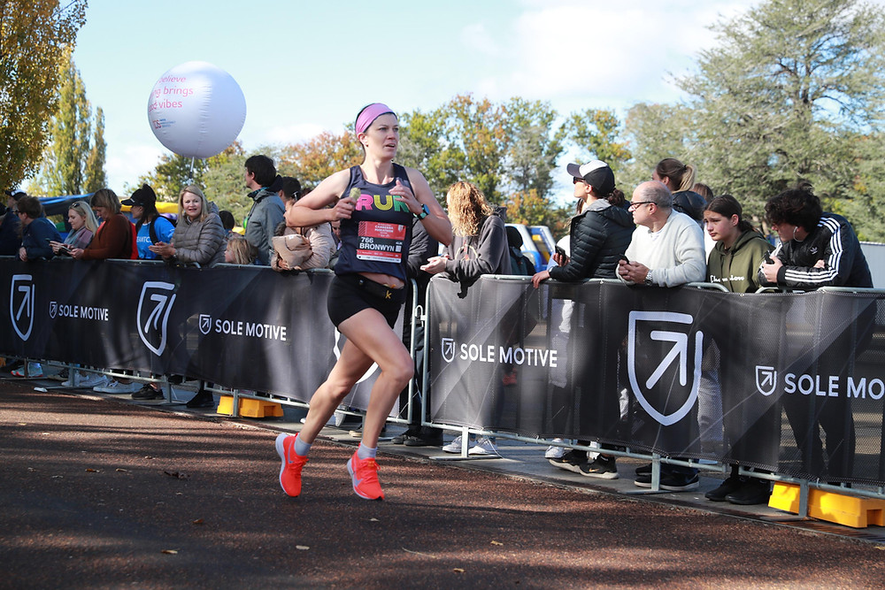 Image of me finishing the 2021 Canberra Marathon
