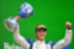 Isack Hadjar hoisting the 3rd place trophy after securing his first-career F1 grand prix podium. C/O to F1 media via the-race.com