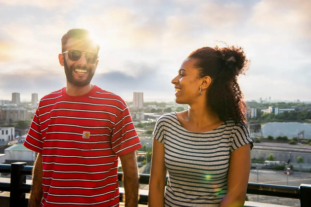 Advertising photographer Celso Marrero shoots a couple on a London's rooftop at sunset. Commercial photography for editorial