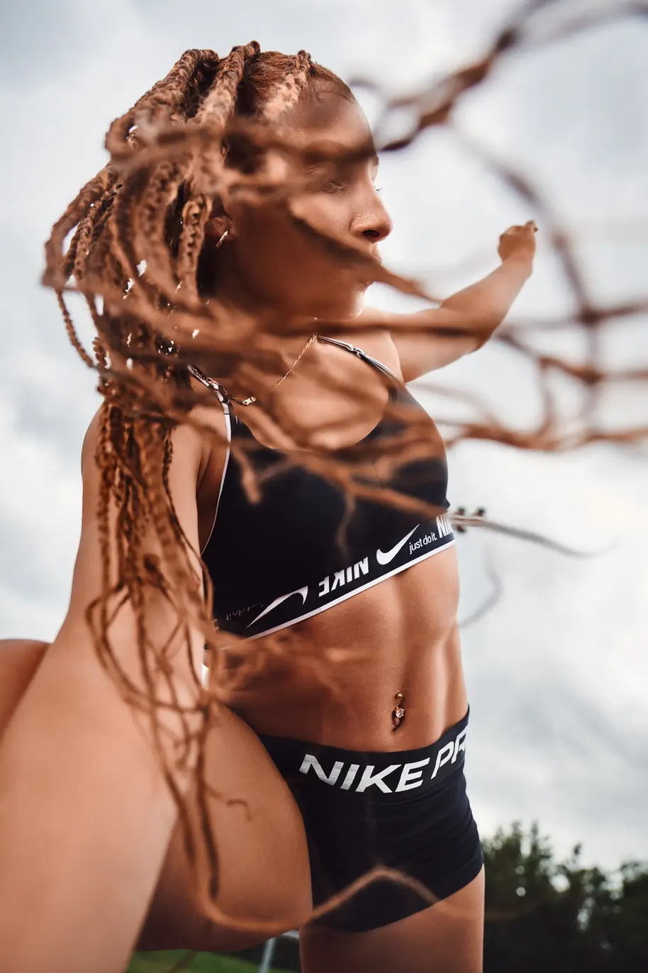 Athlete stretching in a track wearing a nike suit. Photographed by lifestyle and sport photographer in london Celso Marrero