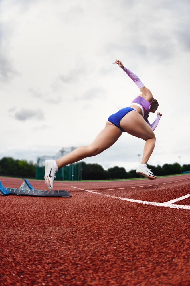 Sprinter in action on a track, photographed in dynamic motion by sports photographer in London Celso Marrero.