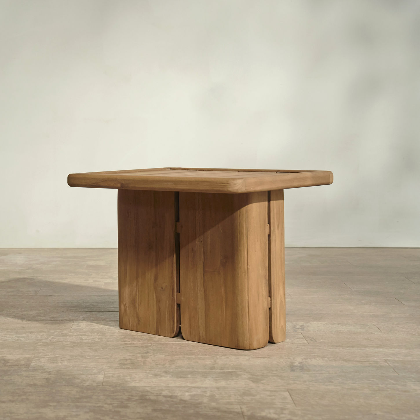 Modern outdoor end table with slatted top and leg