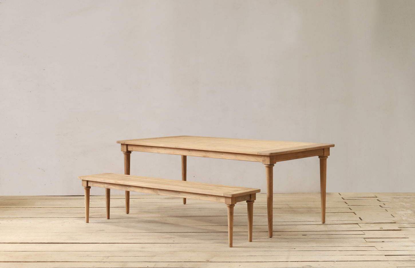 Aceh Outdoor Dining Table in reclaimed teakwood with tapered lathe legs and a clean minimalist design.