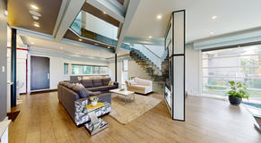 Open-plan living room with glass staircase in a North York detached home
