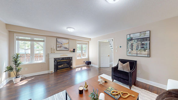 Living room with fireplace and hardwood floor in a Burlington home