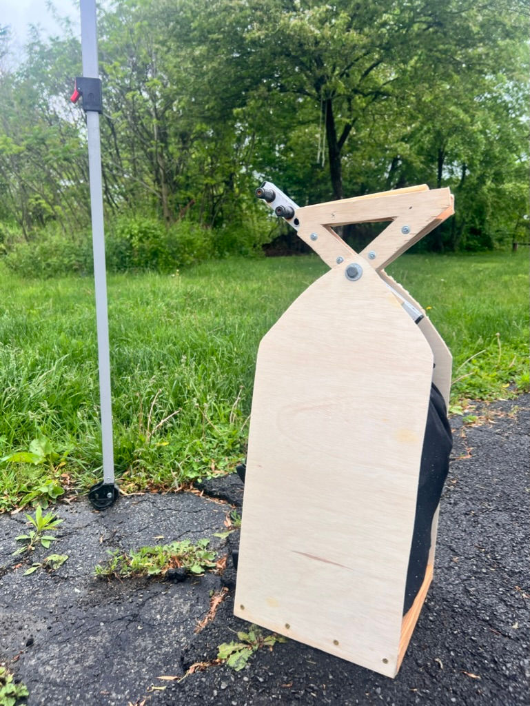 A Burro Tent Weight prototype made from wood.