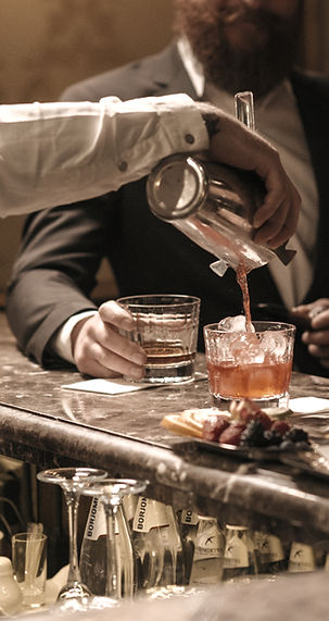 Bartender serving cocktails_edited.jpg