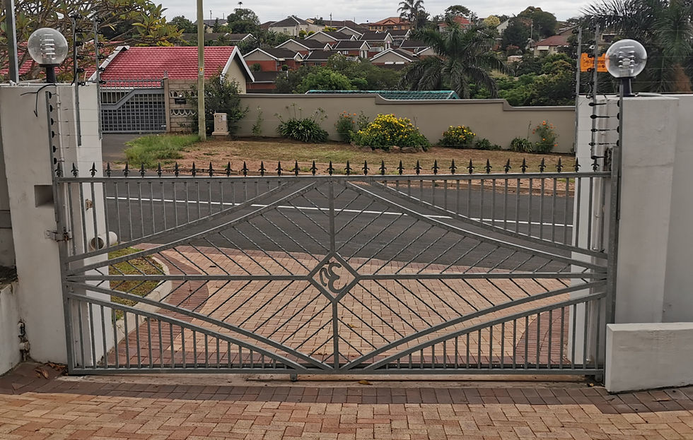 Close-up view of sliding gate motor and track system