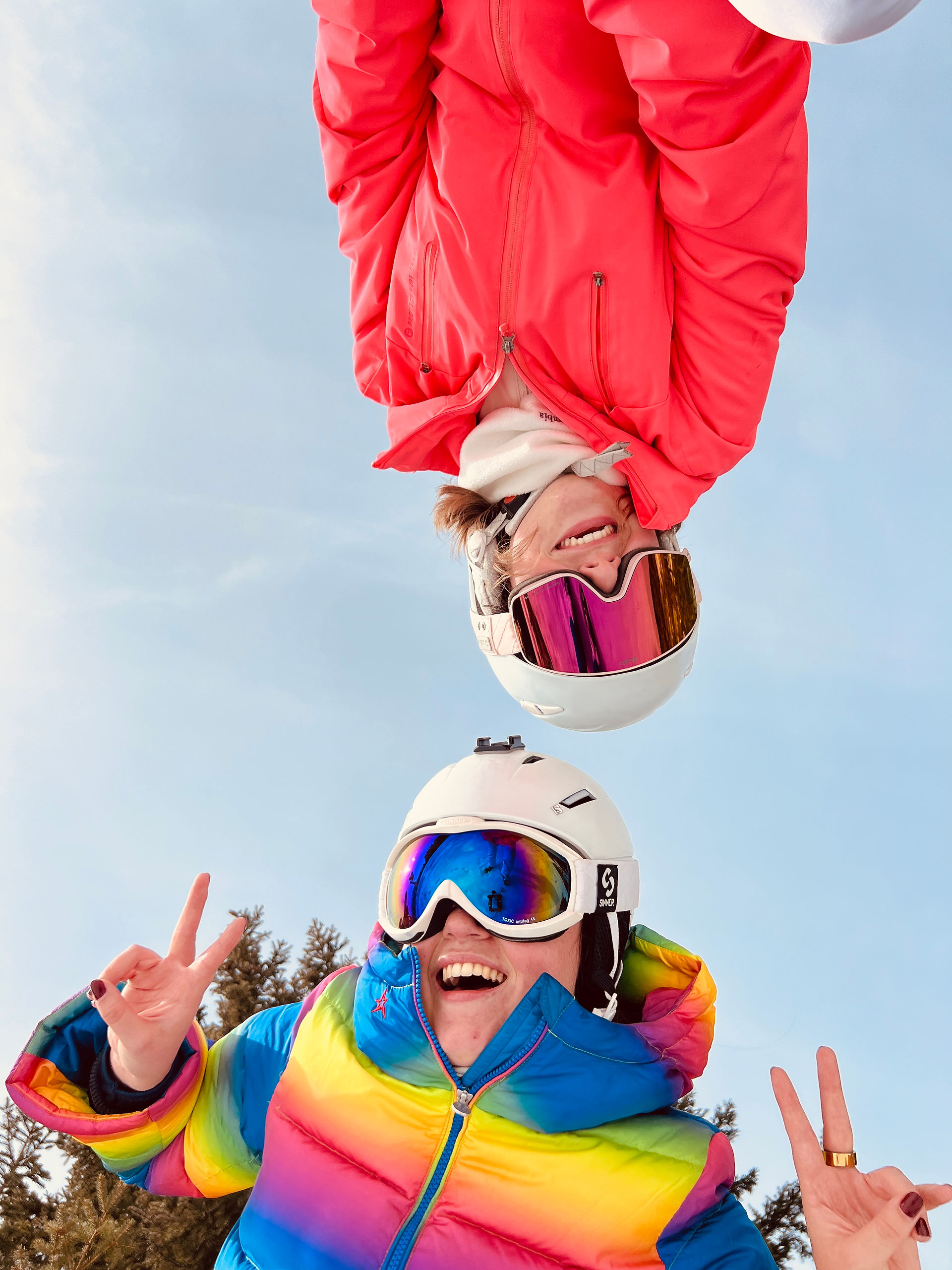 two girls having fun in the snow in Saalbach