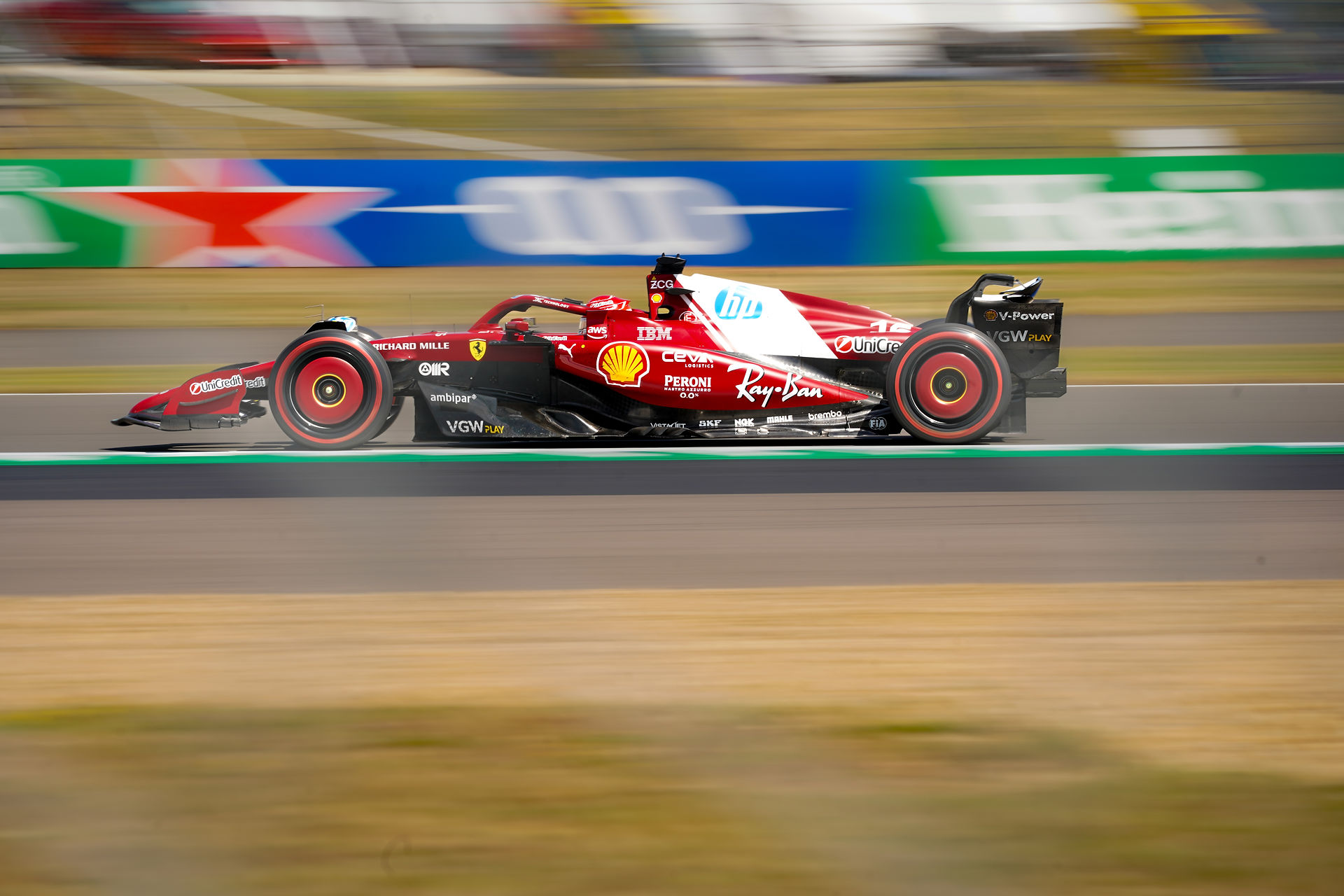 Ferrari Charles Leclerc F1 car full-speed panning shot at Silverstone GP 2025