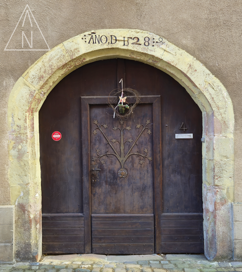 Dark wooden arched door at Rue Saint-Jean, Wissembourg
