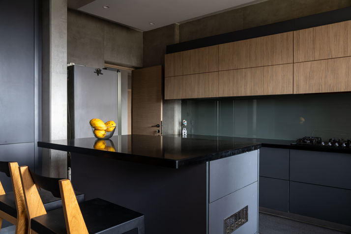 Spacious lounge area featuring clean lines and natural wood finishes