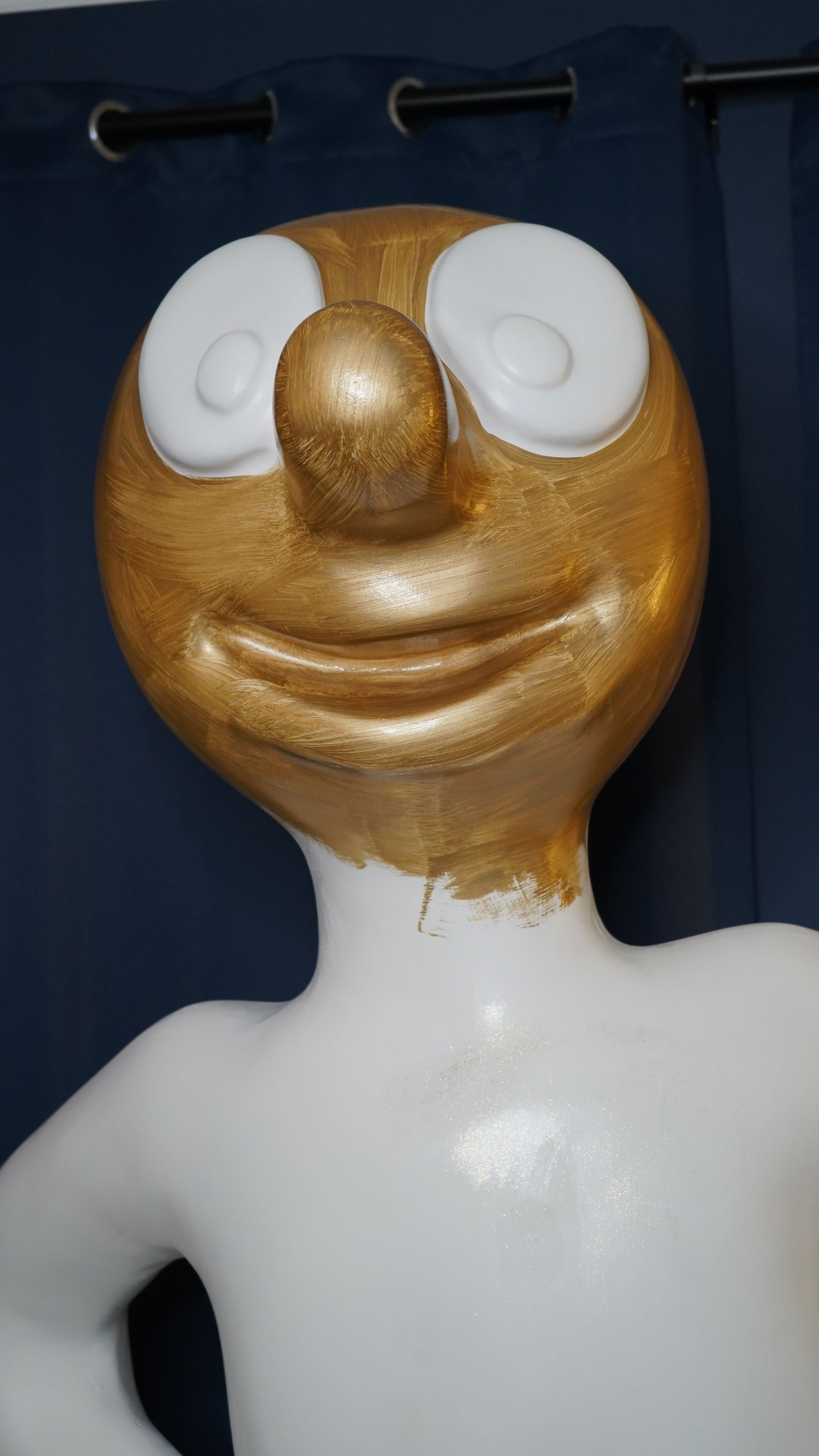 Applying gold paint to the Morph sculpture. Art Trail - Morph's Epic Art Adventure In London 2023